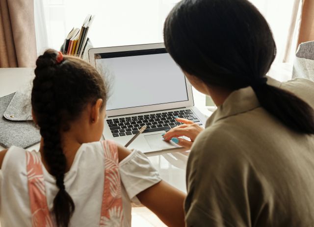 Mother Helping her Daughter with Homework